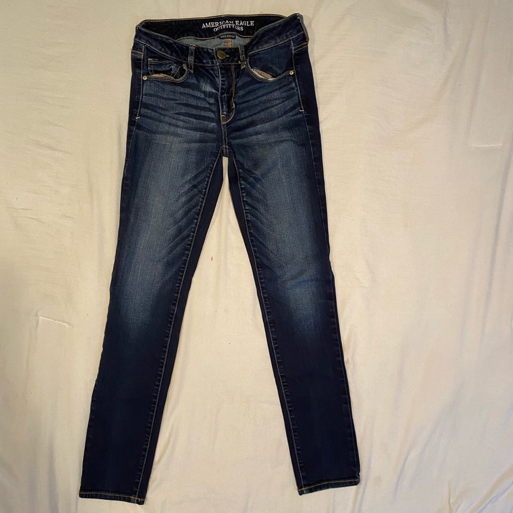 Dark colored American Eagle jeans.